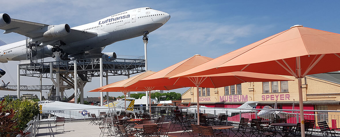 Technical museum Speyer with several umbrellas on sun terrace